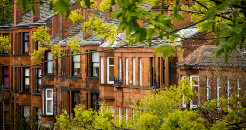 AREA PAGE Row of Red Sandstone Tenement Flats Southside of Glasgow shutterstock_709387300